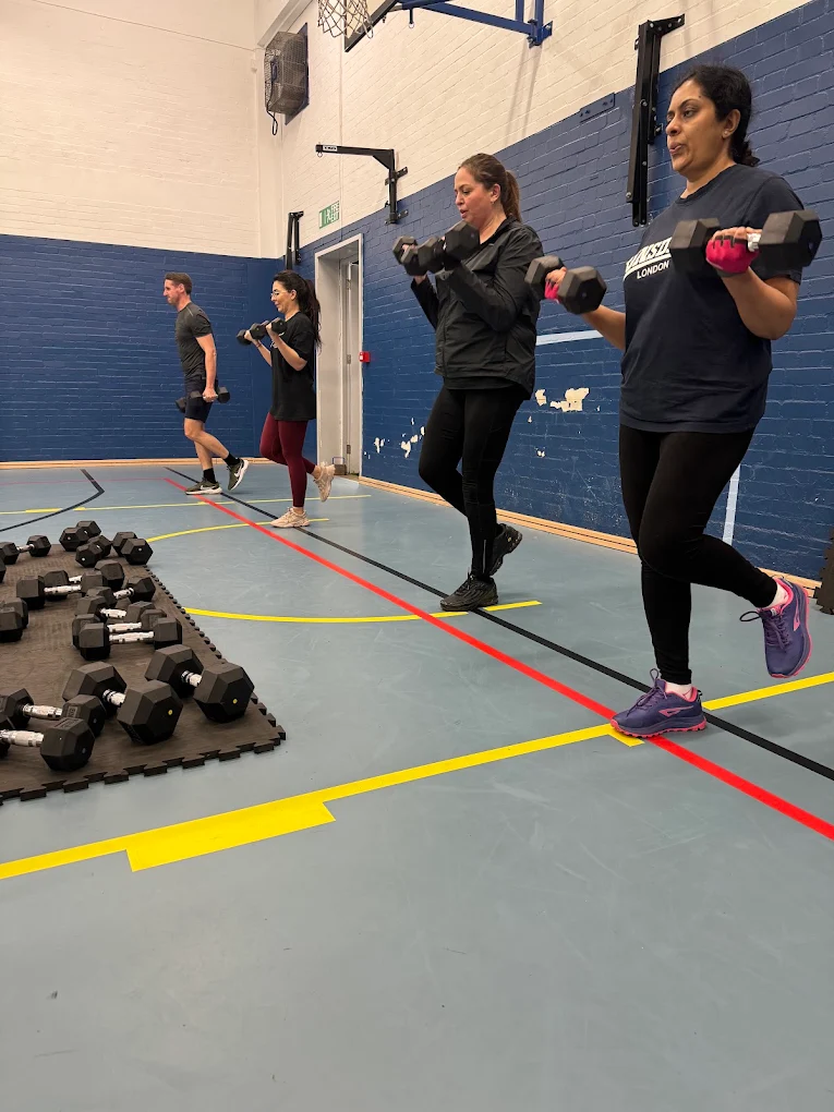 Feel Good Fitness members training with dumbbells